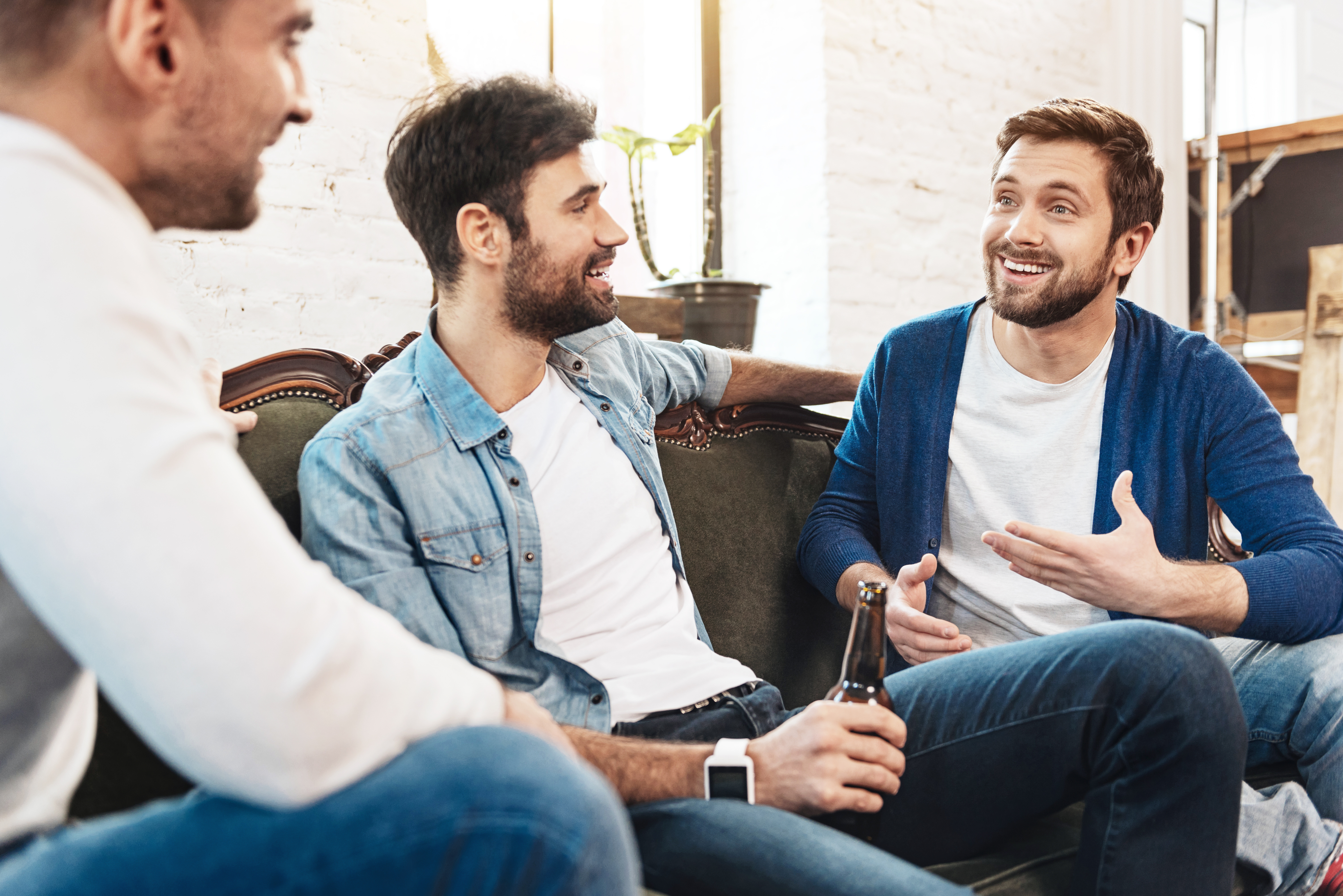 Nice joyful men chatting with each other